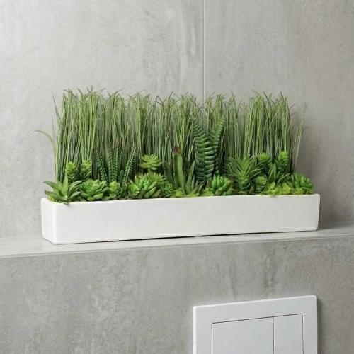 Sztuczna trawa sukulentami w doniczce 